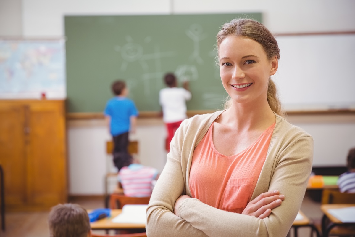 OECU member — teacher in classroom with students